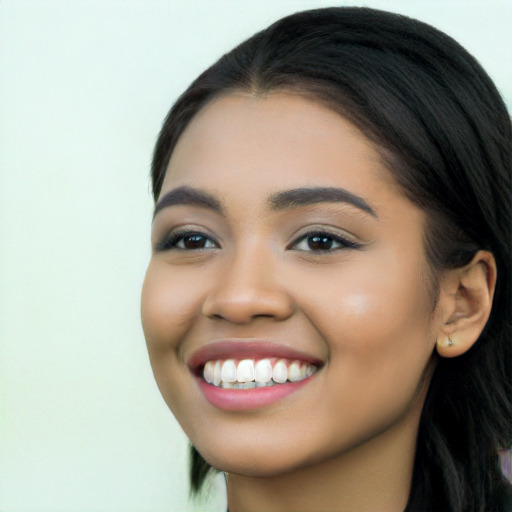 Joyful latino young-adult female with long  black hair and brown eyes