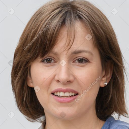 Joyful white adult female with medium  brown hair and grey eyes