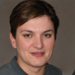 Joyful white adult female with short  brown hair and brown eyes