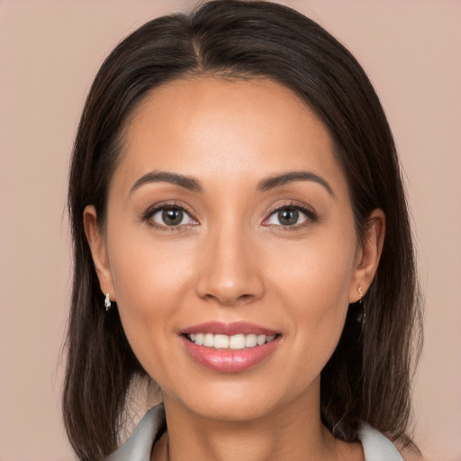 Joyful white young-adult female with medium  brown hair and brown eyes