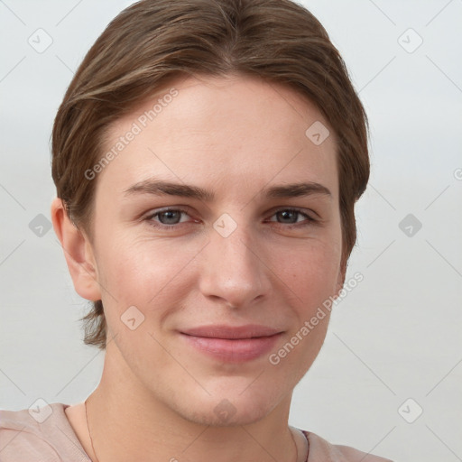 Joyful white young-adult female with short  brown hair and grey eyes