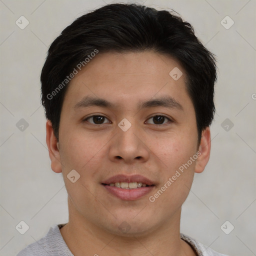 Joyful asian young-adult male with short  brown hair and brown eyes