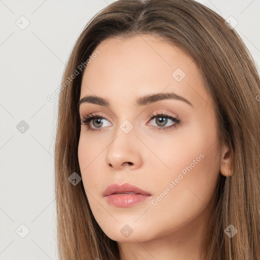 Neutral white young-adult female with long  brown hair and brown eyes