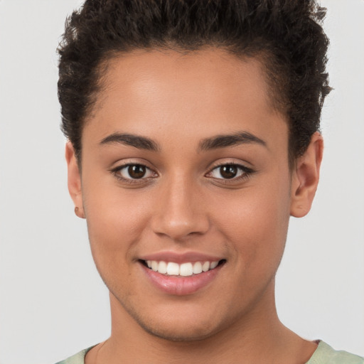 Joyful white young-adult female with short  brown hair and brown eyes