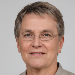 Joyful white middle-aged male with short  brown hair and grey eyes