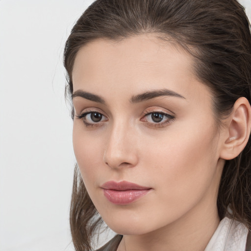 Neutral white young-adult female with medium  brown hair and brown eyes