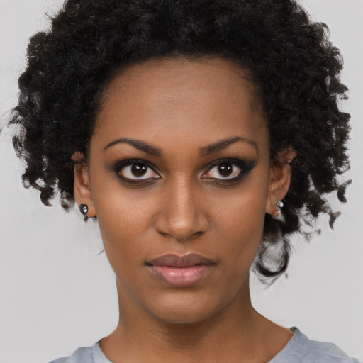 Neutral black young-adult female with short  black hair and brown eyes