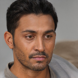 Neutral latino young-adult male with short  brown hair and brown eyes