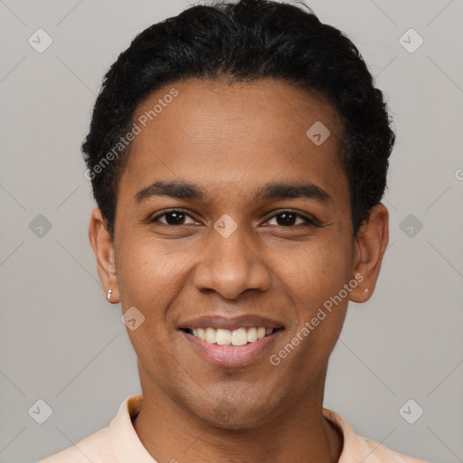 Joyful black young-adult male with short  black hair and brown eyes