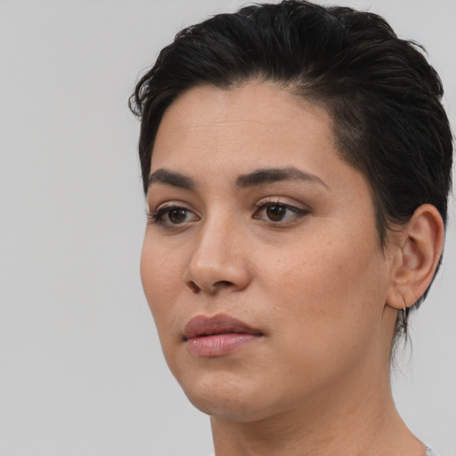 Neutral white young-adult female with short  black hair and brown eyes