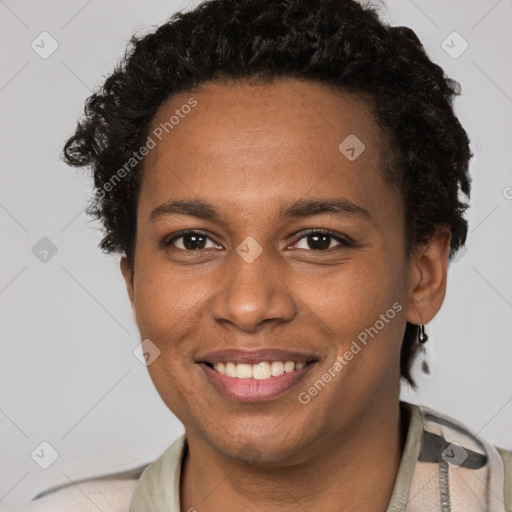 Joyful black adult female with short  brown hair and brown eyes