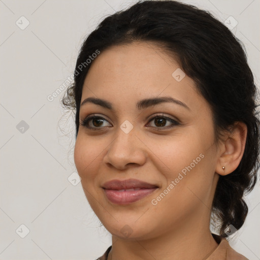 Joyful latino young-adult female with medium  brown hair and brown eyes