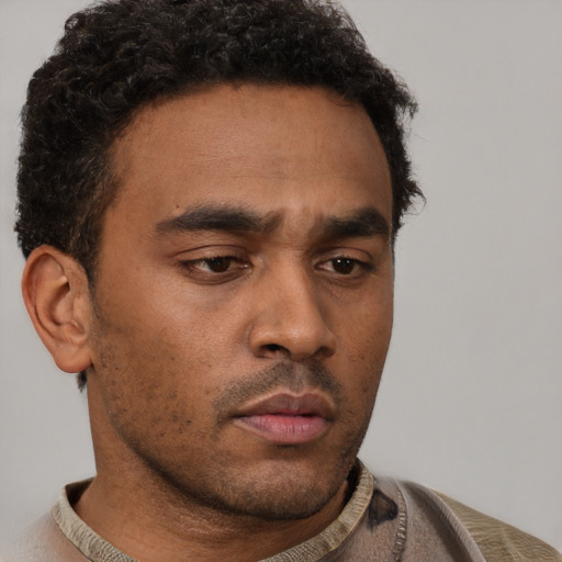 Neutral latino young-adult male with short  brown hair and brown eyes