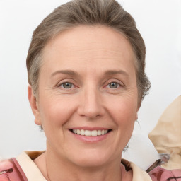 Joyful white adult female with short  brown hair and grey eyes