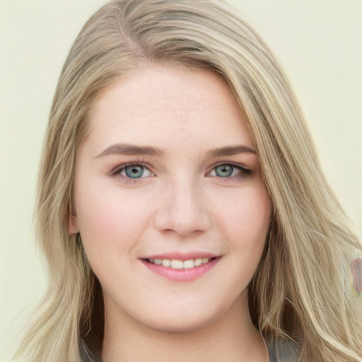 Joyful white young-adult female with long  brown hair and blue eyes