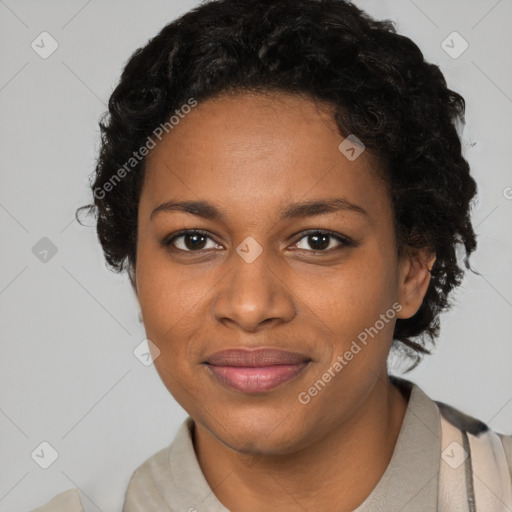 Joyful black young-adult female with short  brown hair and brown eyes