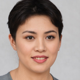 Joyful asian young-adult female with short  brown hair and brown eyes