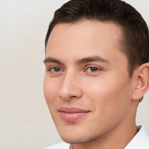 Joyful white young-adult male with short  brown hair and brown eyes