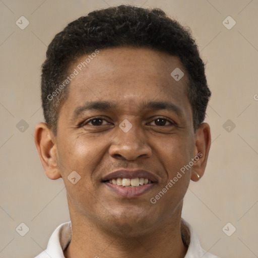 Joyful latino young-adult male with short  brown hair and brown eyes