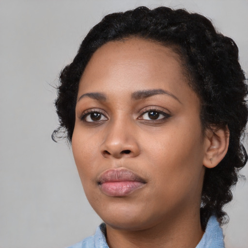 Neutral black young-adult female with medium  black hair and brown eyes