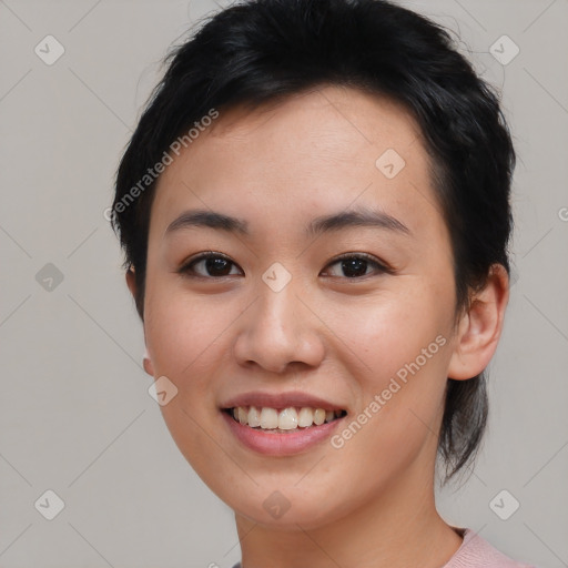 Joyful asian young-adult female with medium  black hair and brown eyes