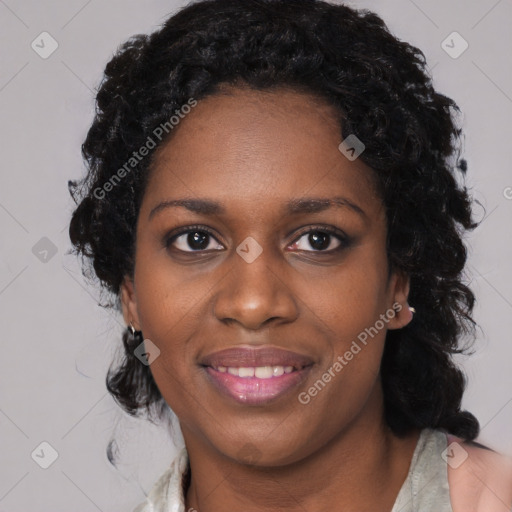 Joyful black young-adult female with medium  black hair and brown eyes