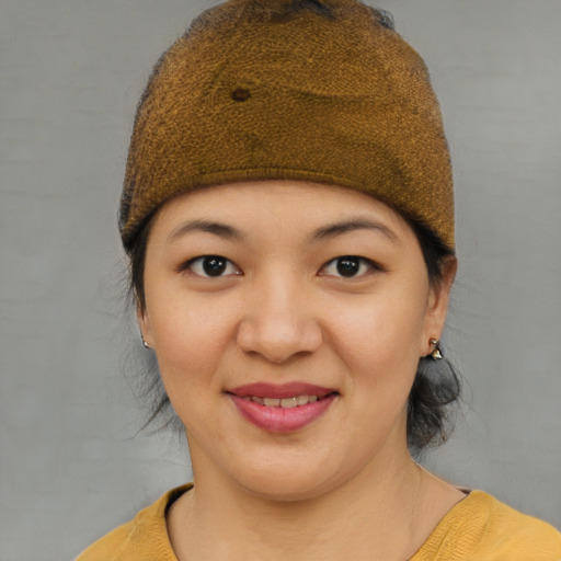Joyful asian young-adult female with short  brown hair and brown eyes