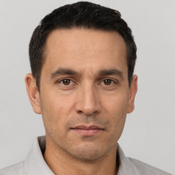 Neutral white adult male with short  black hair and brown eyes