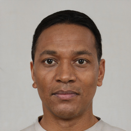 Neutral black adult male with short  black hair and brown eyes