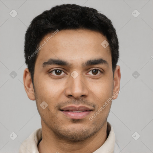 Joyful latino young-adult male with short  black hair and brown eyes