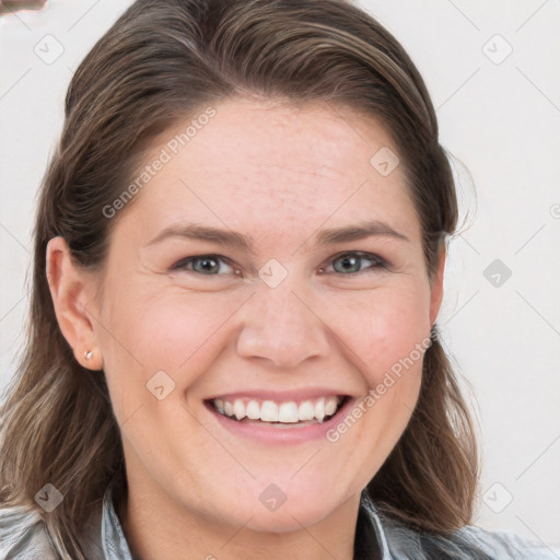 Joyful white young-adult female with medium  brown hair and blue eyes