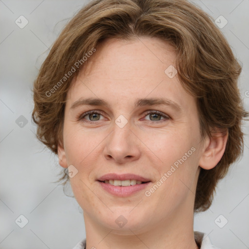 Joyful white adult female with medium  brown hair and grey eyes