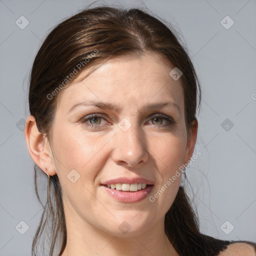 Joyful white adult female with medium  brown hair and grey eyes