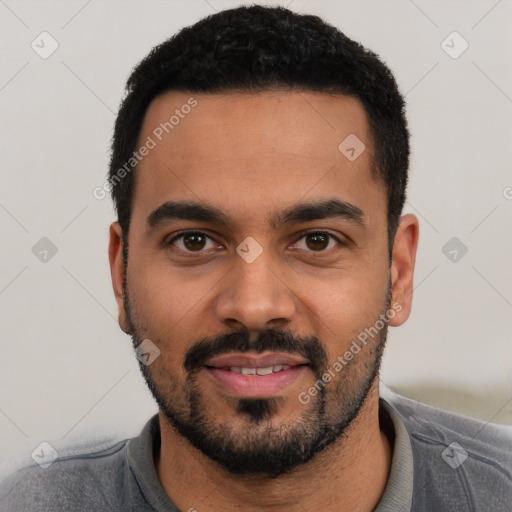 Joyful latino young-adult male with short  black hair and brown eyes