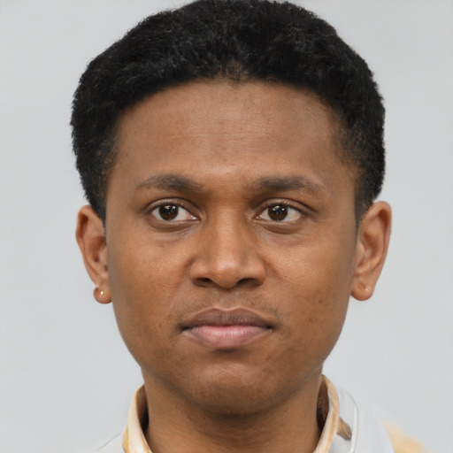 Neutral latino young-adult male with short  brown hair and brown eyes