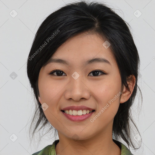 Joyful asian young-adult female with medium  black hair and brown eyes