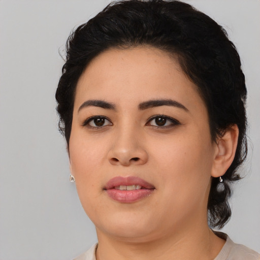 Joyful asian young-adult female with medium  black hair and brown eyes