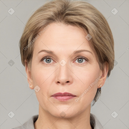 Joyful white adult female with short  brown hair and grey eyes