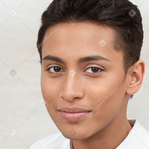 Joyful white young-adult male with short  brown hair and brown eyes