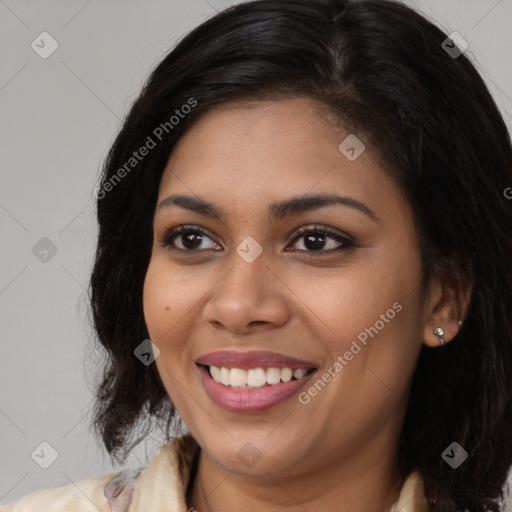 Joyful latino young-adult female with long  brown hair and brown eyes