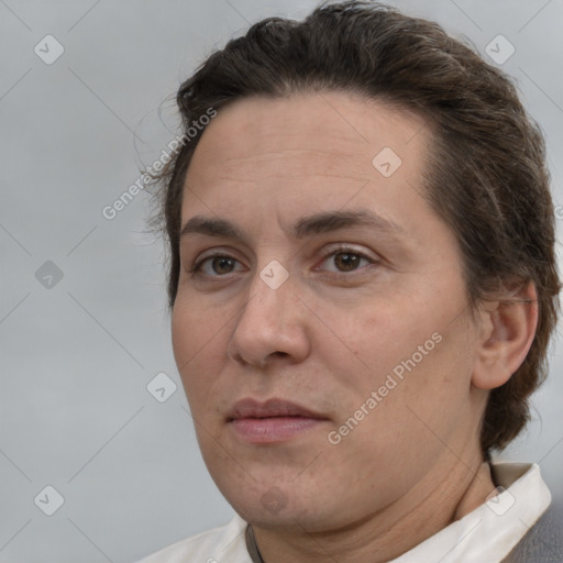 Joyful white adult female with short  brown hair and brown eyes