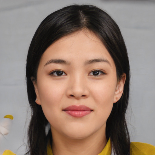 Joyful asian young-adult female with medium  black hair and brown eyes