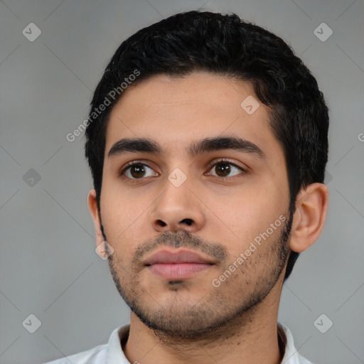 Neutral latino young-adult male with short  black hair and brown eyes