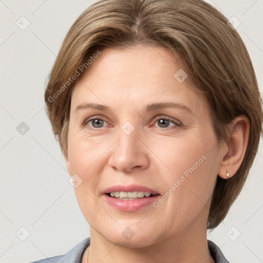 Joyful white adult female with short  brown hair and grey eyes