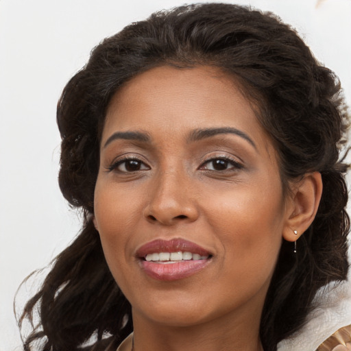 Joyful white adult female with long  brown hair and brown eyes