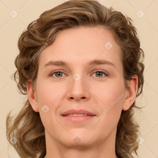 Joyful white young-adult female with medium  brown hair and green eyes