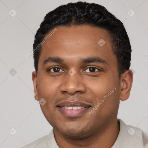 Joyful black young-adult male with short  black hair and brown eyes