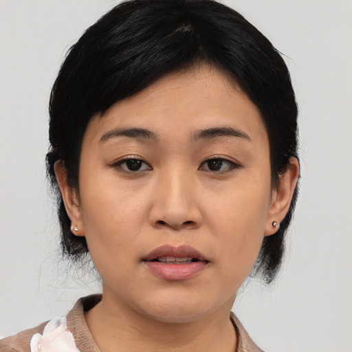 Neutral asian young-adult female with medium  black hair and brown eyes