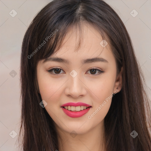 Joyful asian young-adult female with long  brown hair and brown eyes