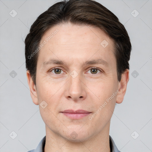 Joyful white adult male with short  brown hair and brown eyes